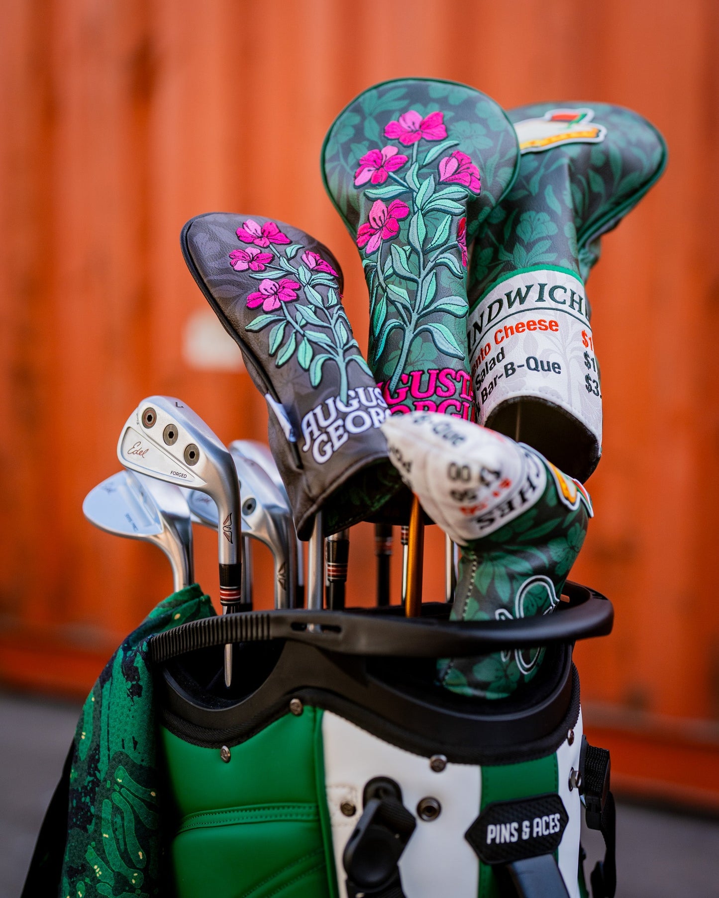 Augusta '25 Blade Putter Cover in vibrant green, featuring a sleek design and padded protection for golf putters.