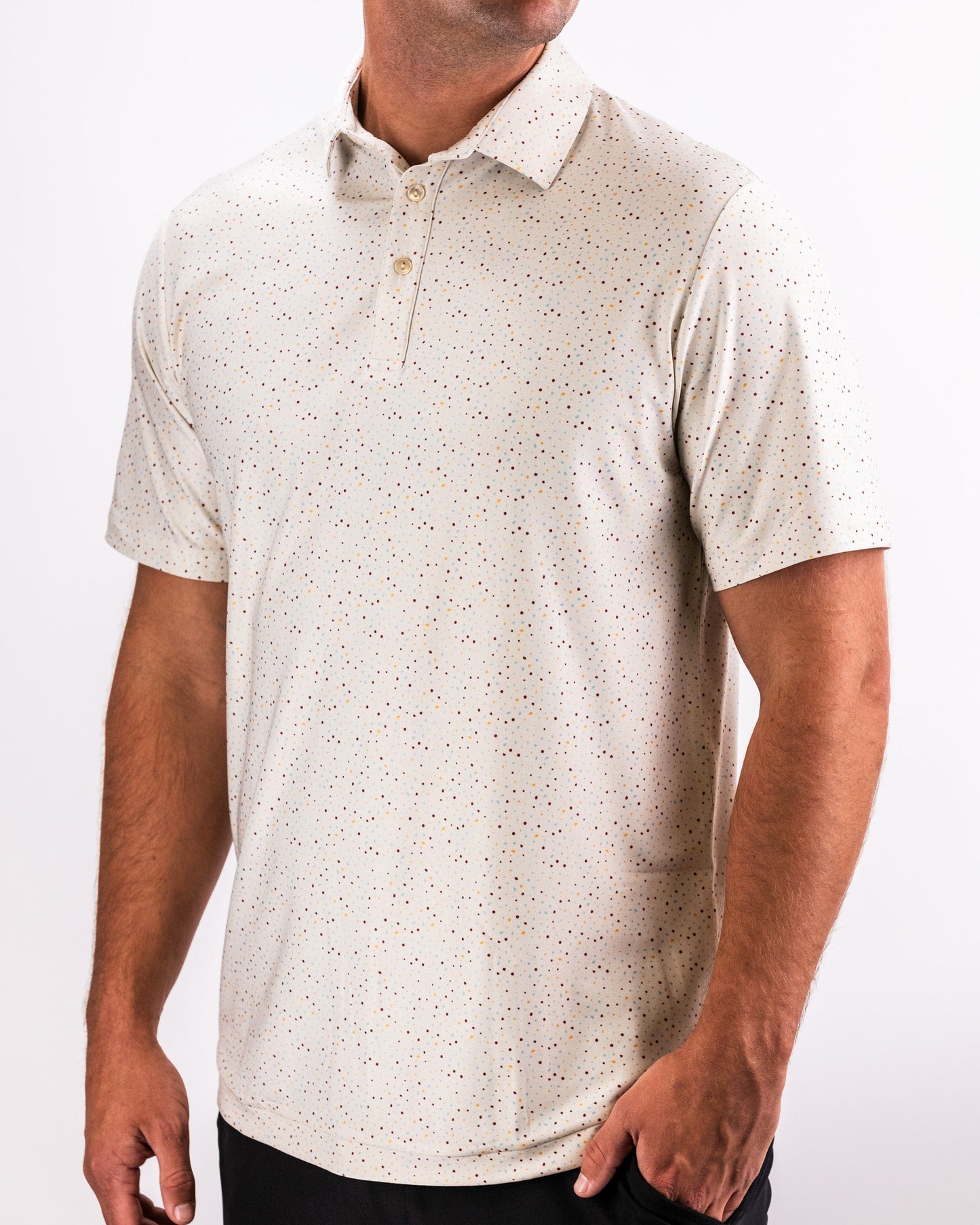 Alt text: "Player Preferred™ Polo in Terrazzo pattern featuring a lightweight, breathable fabric, perfect for casual or athletic wear."