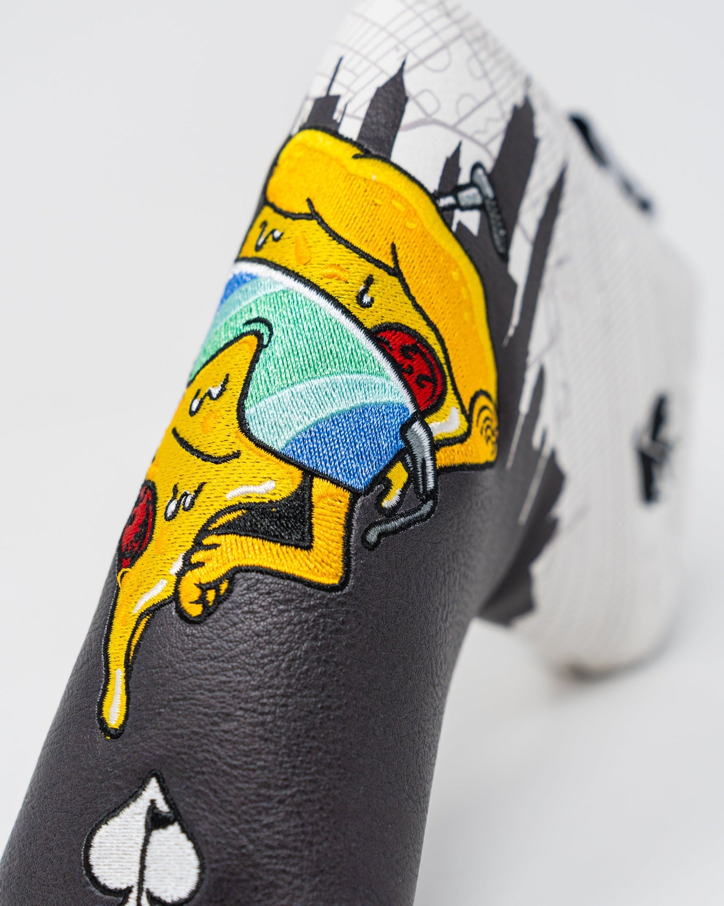 Shady Slice Blade Putter Cover featuring a stylish design with vibrant colors and a secure fit for blade-style putters.