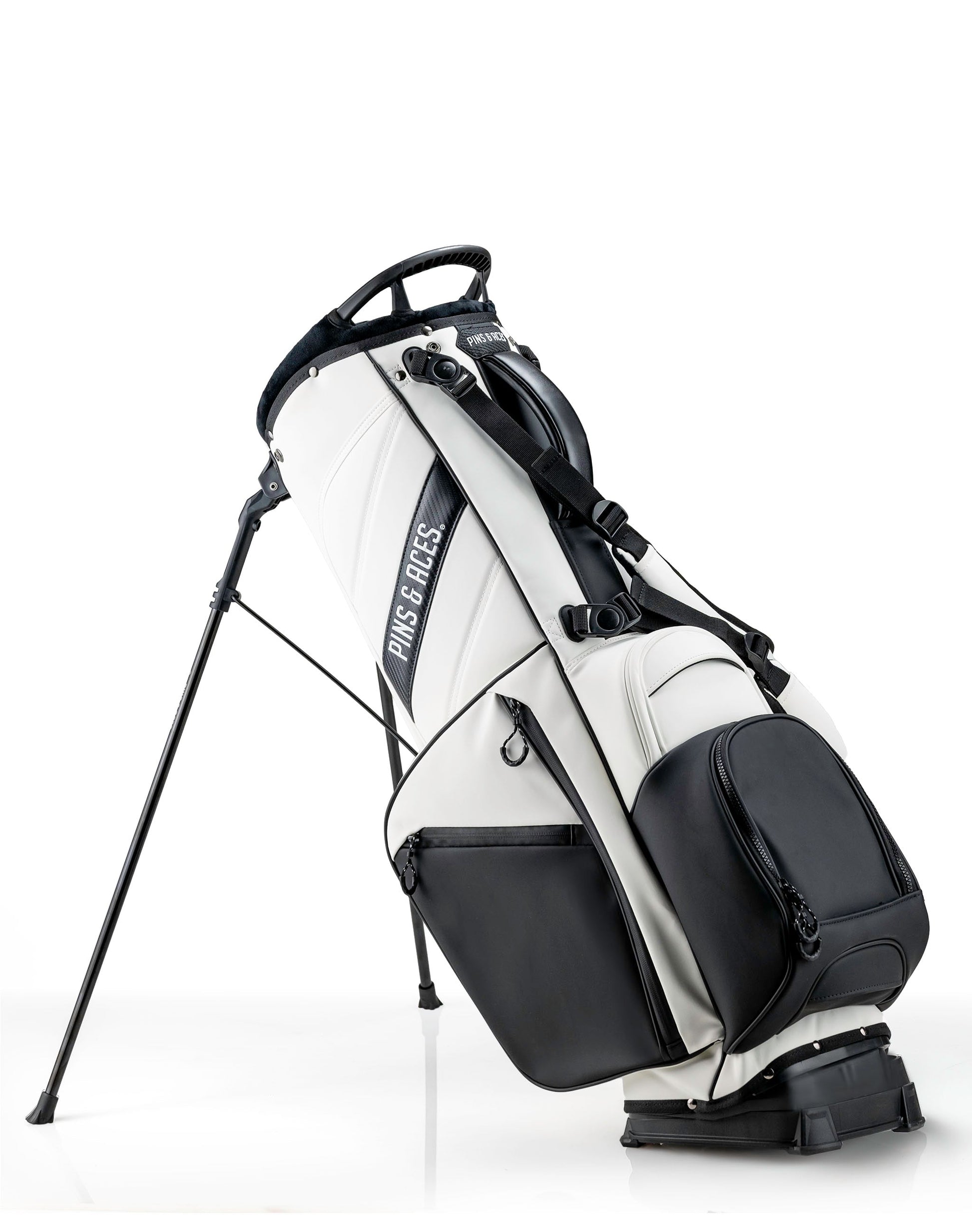 Stylish Player Preferred Golf Bag in white and black, featuring a sleek design and sturdy stand for golfers.