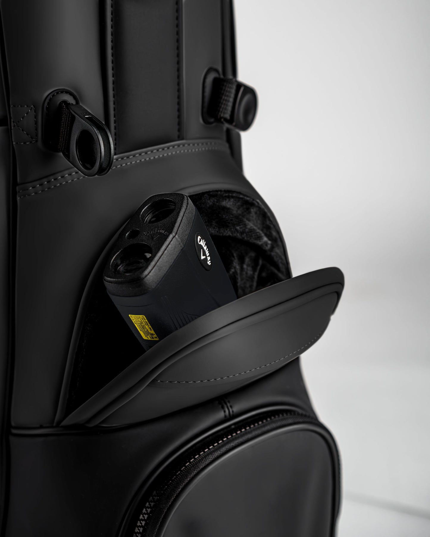 Close-up of the Player Preferred Golf Bag in Obsidian, featuring a pocket with a golf rangefinder inside.