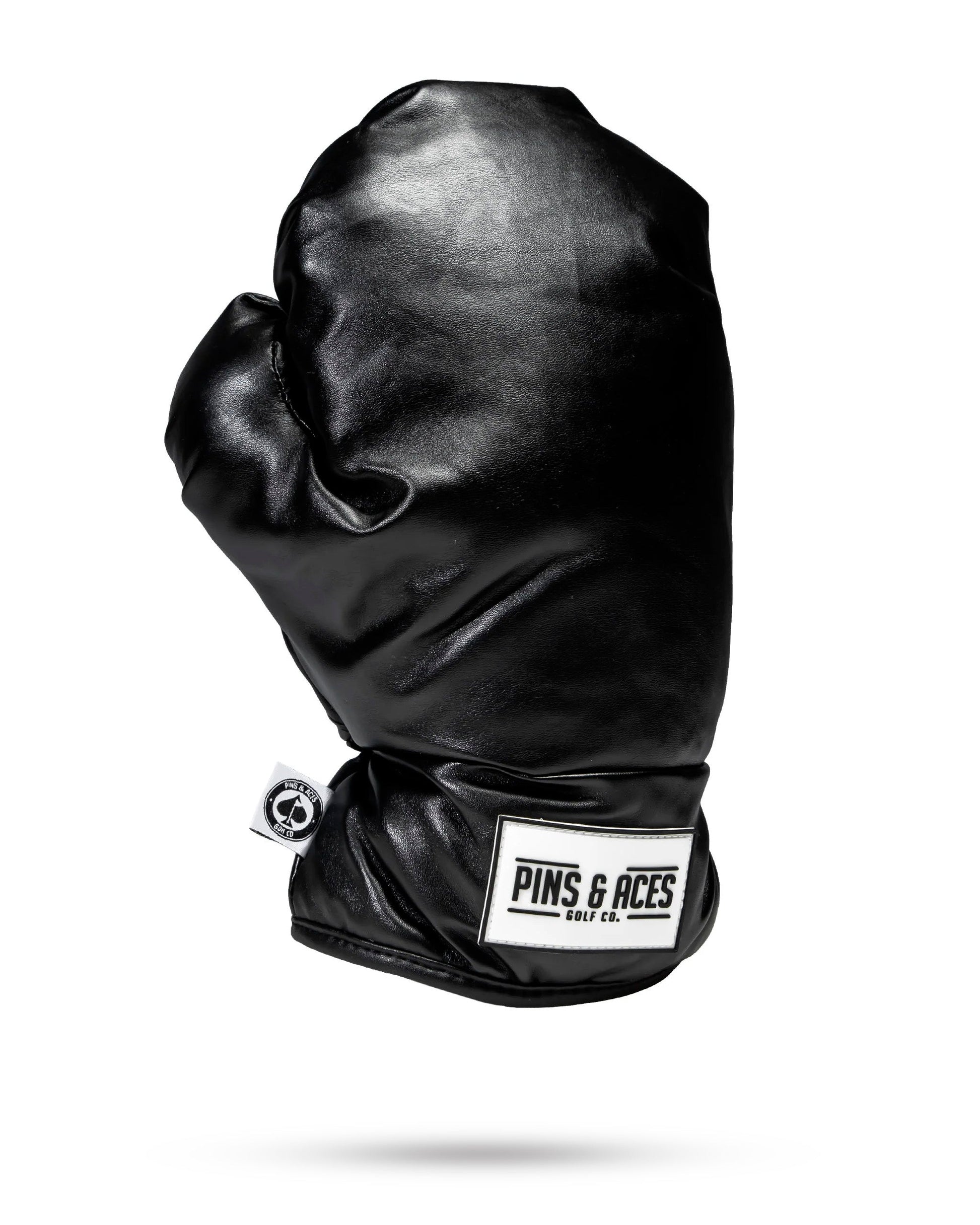 Black boxing glove driver cover, designed for golf club protection with a sleek and sporty appearance.