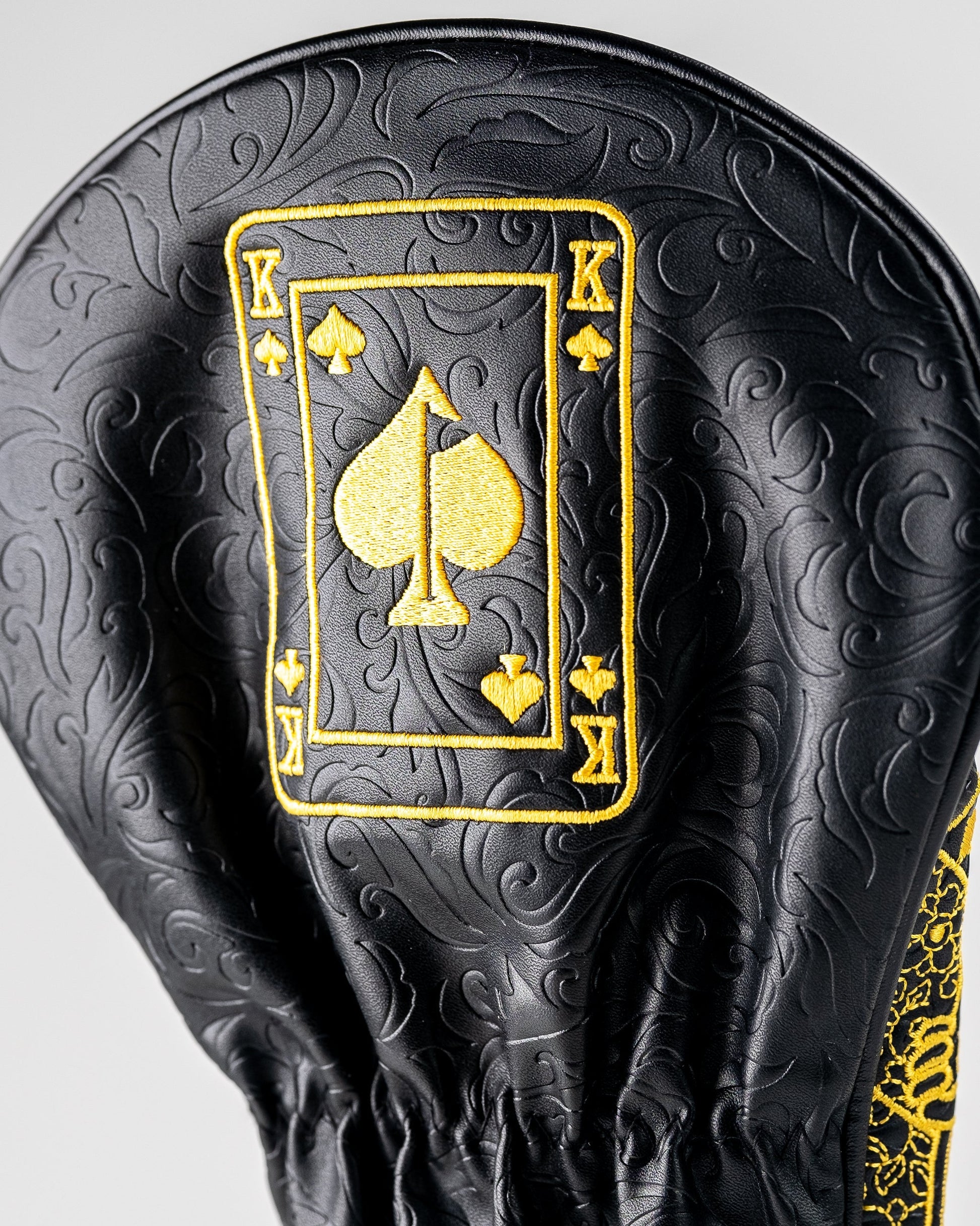 Black and gold King of Spades driver cover featuring a bold spade design, designed to protect golf clubs with style.