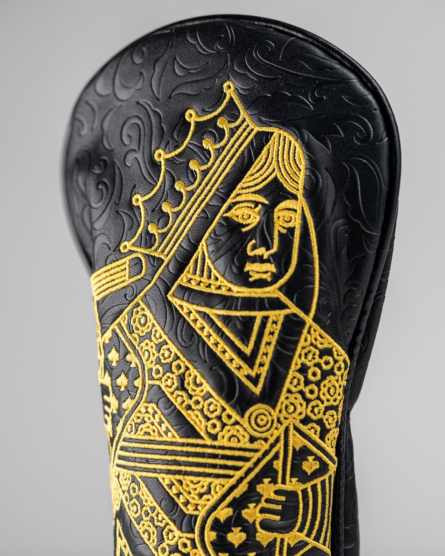 Black and gold Queen of Spades fairway cover with a sleek design, featuring a spade emblem.
