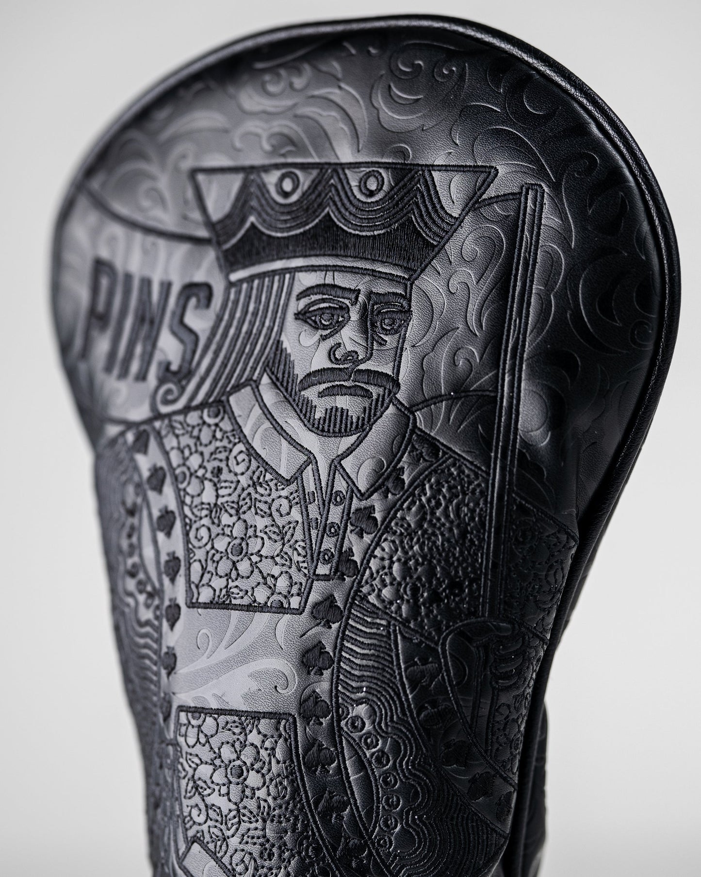 Blackout King of Spades golf driver cover with sleek black design and spade emblem.
