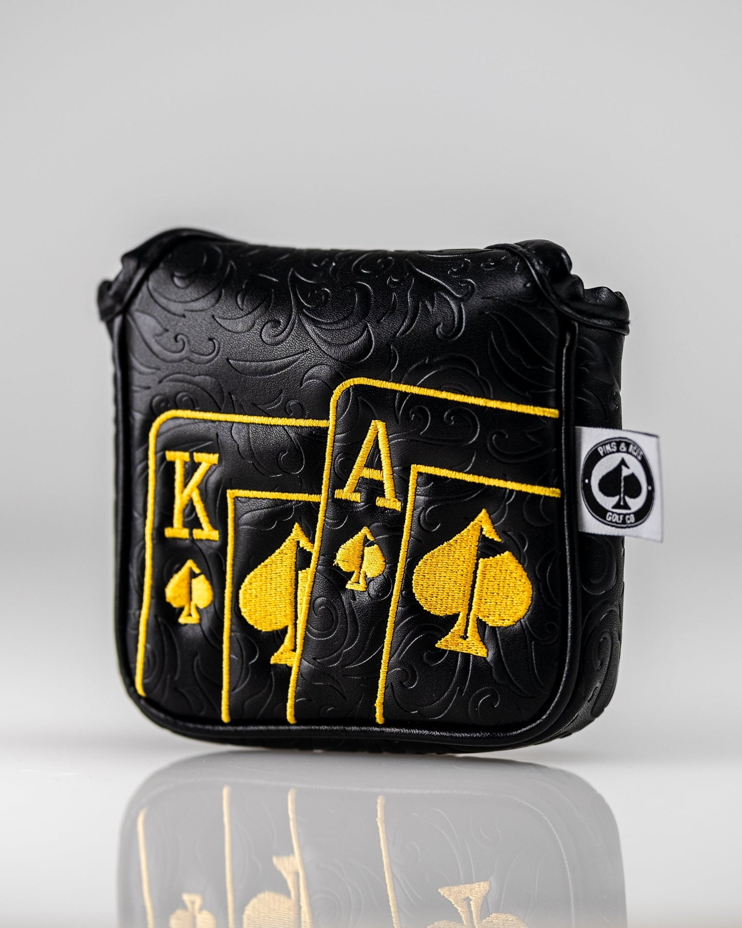 Black and gold Ace of Spades mallet putter cover featuring a sleek design and durable material.