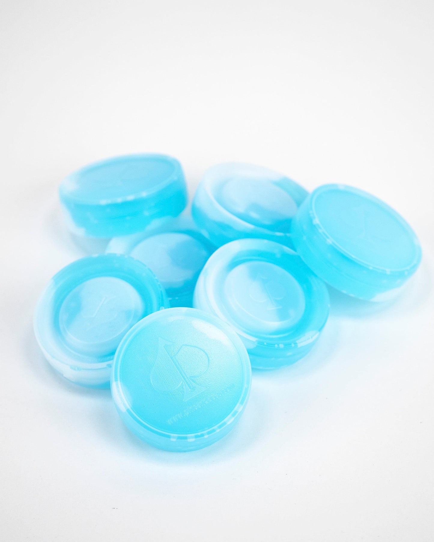 Blue beer sleeve ice pucks designed to keep beverages cold, featuring a sleek, circular shape with a textured surface.