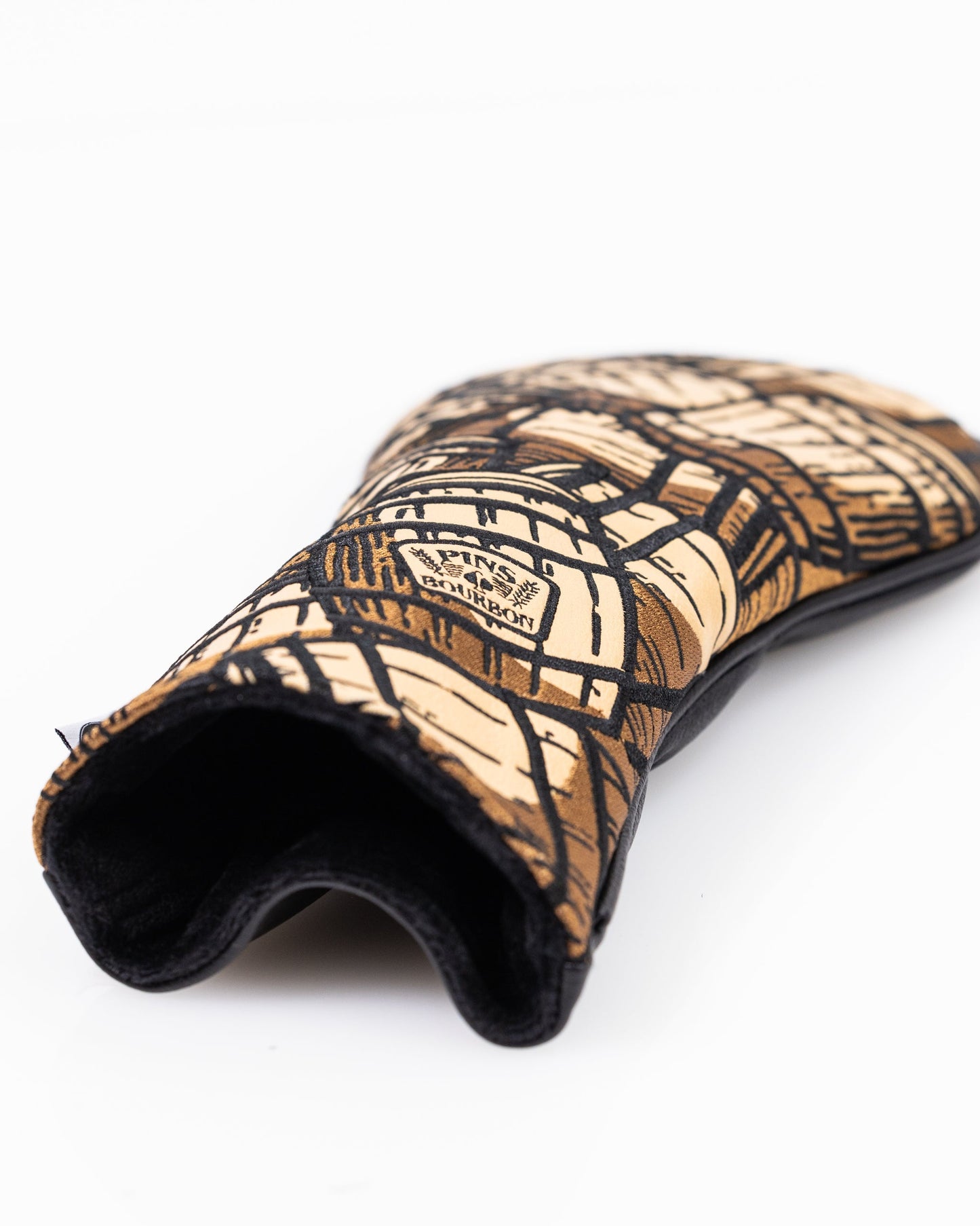 Bourbon barrel-themed golf driver cover made from upcycled material with a rustic design.