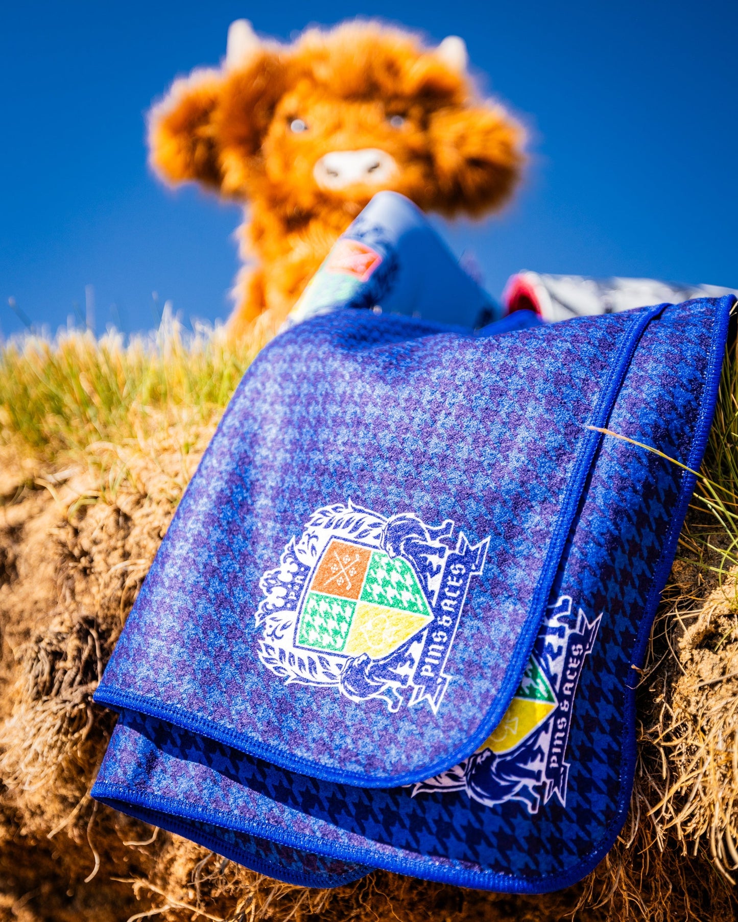 Royal Houndstooth Towel featuring a classic black and white houndstooth pattern, designed for luxury and style.