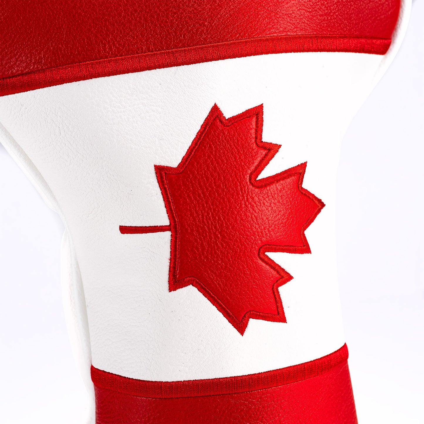 Canada driver cover featuring a textured design with a prominent maple leaf emblem.