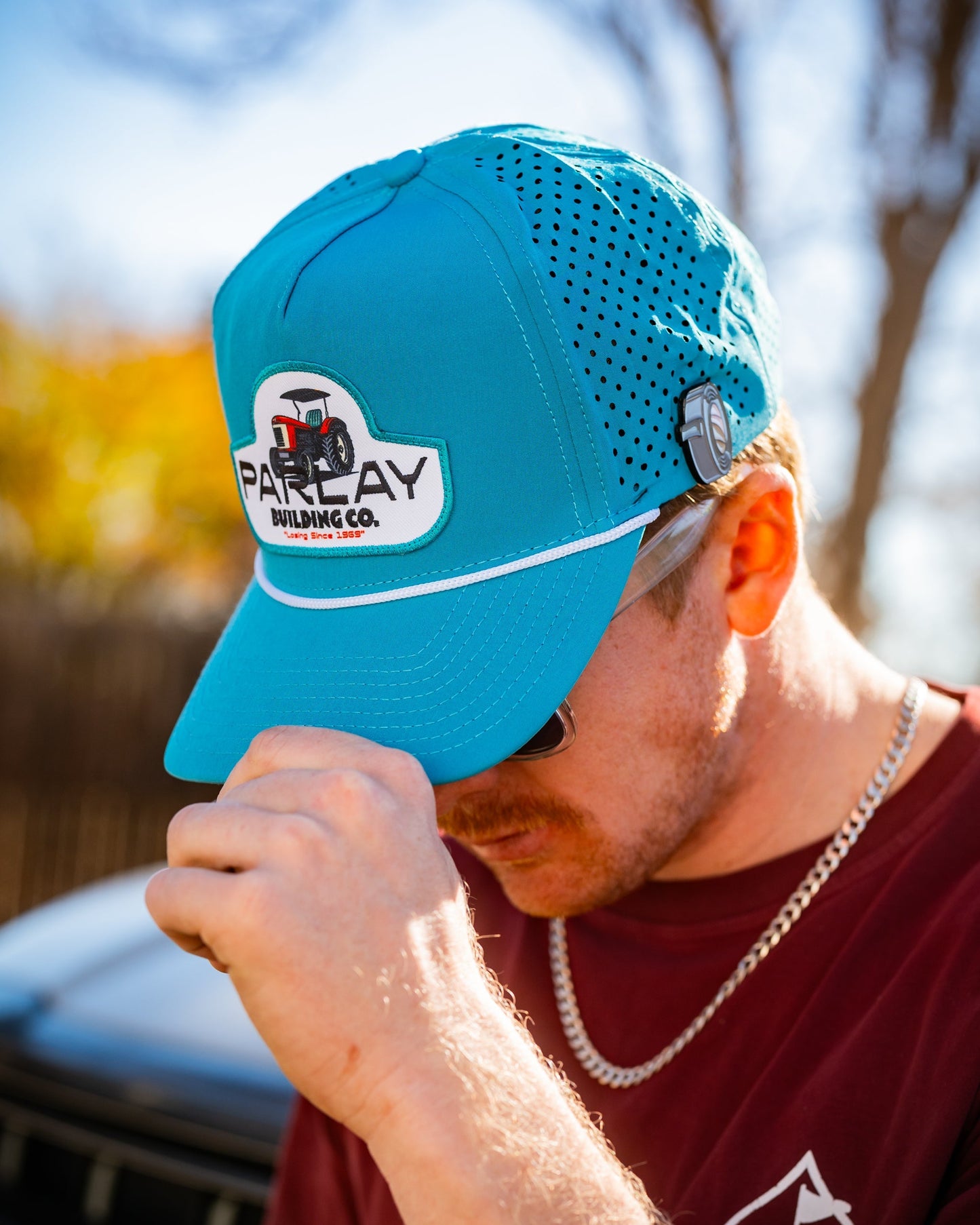 Perforated baby blue rope hat by Parlay Building Co. with a stylish design and adjustable fit.