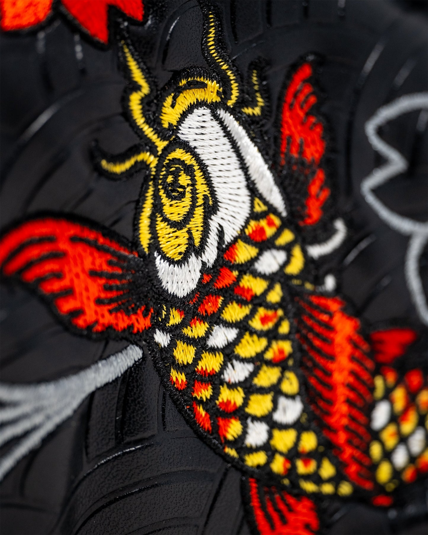 Koi Flow Blade Putter Cover featuring a vibrant fire wave design in shades of orange, red, and blue, designed for enhanced style and protection of golf putters.