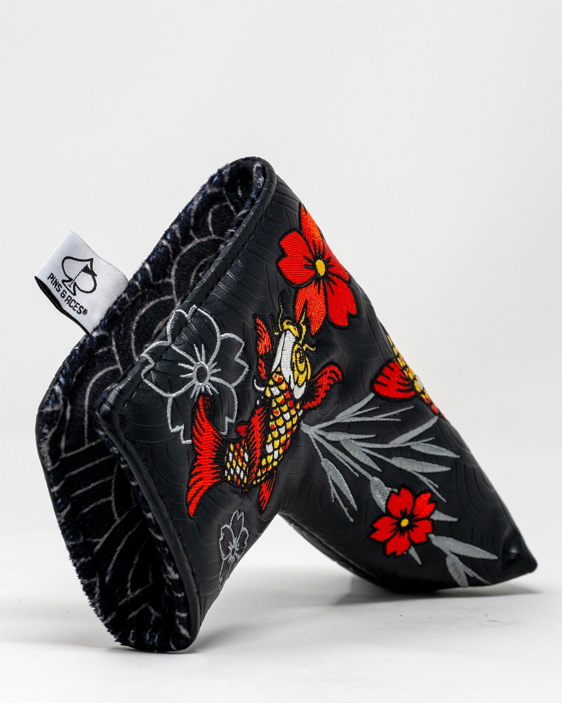 Koi Flow Blade Putter Cover featuring a vibrant fire waves design.