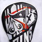 Graffiti-themed driver cover with vibrant multicolored artwork, featuring detailed design and snug fit for a golf club.