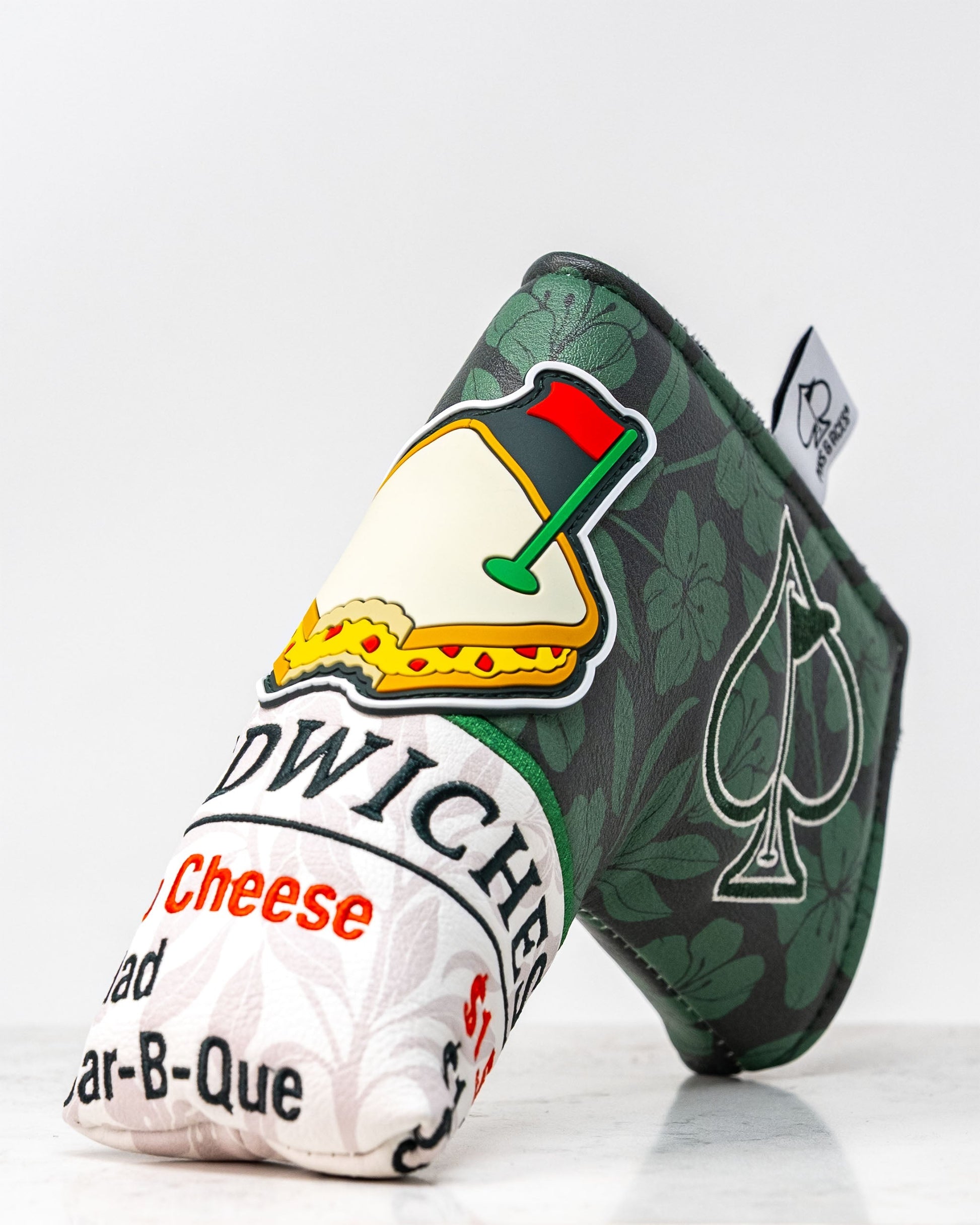 Augusta '25 Blade Putter Cover, featuring a vibrant green design with intricate detailing, perfect for protecting your putter on the golf course.