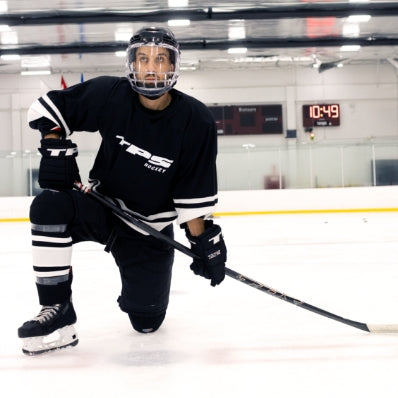 Person in hockey gear on an ice rink 