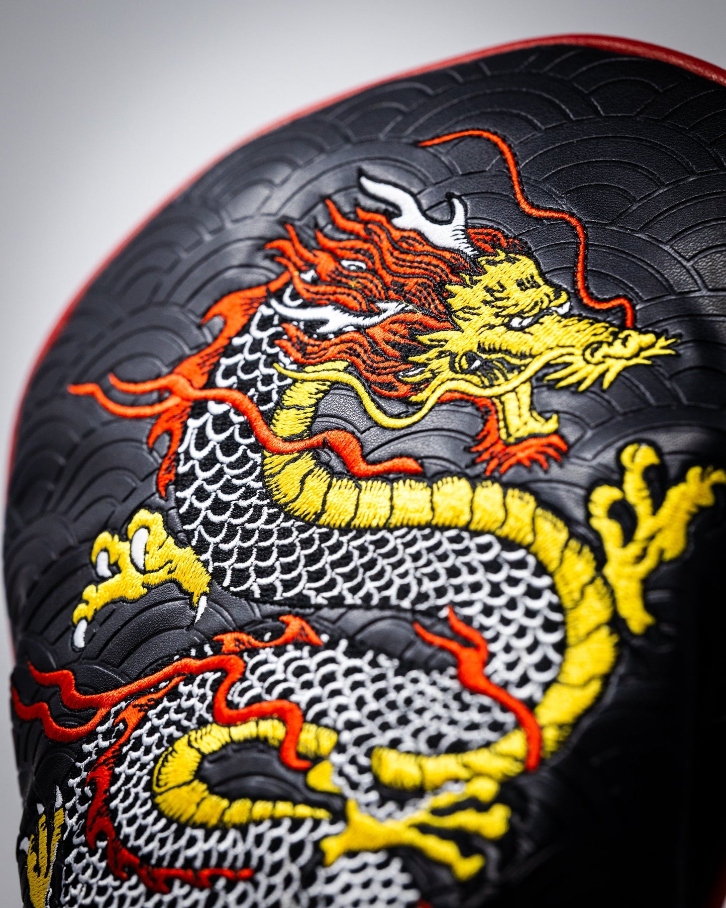 Dragon's Dynasty driver cover featuring an intricate dragon design in vibrant colors, designed to protect golf clubs with style.