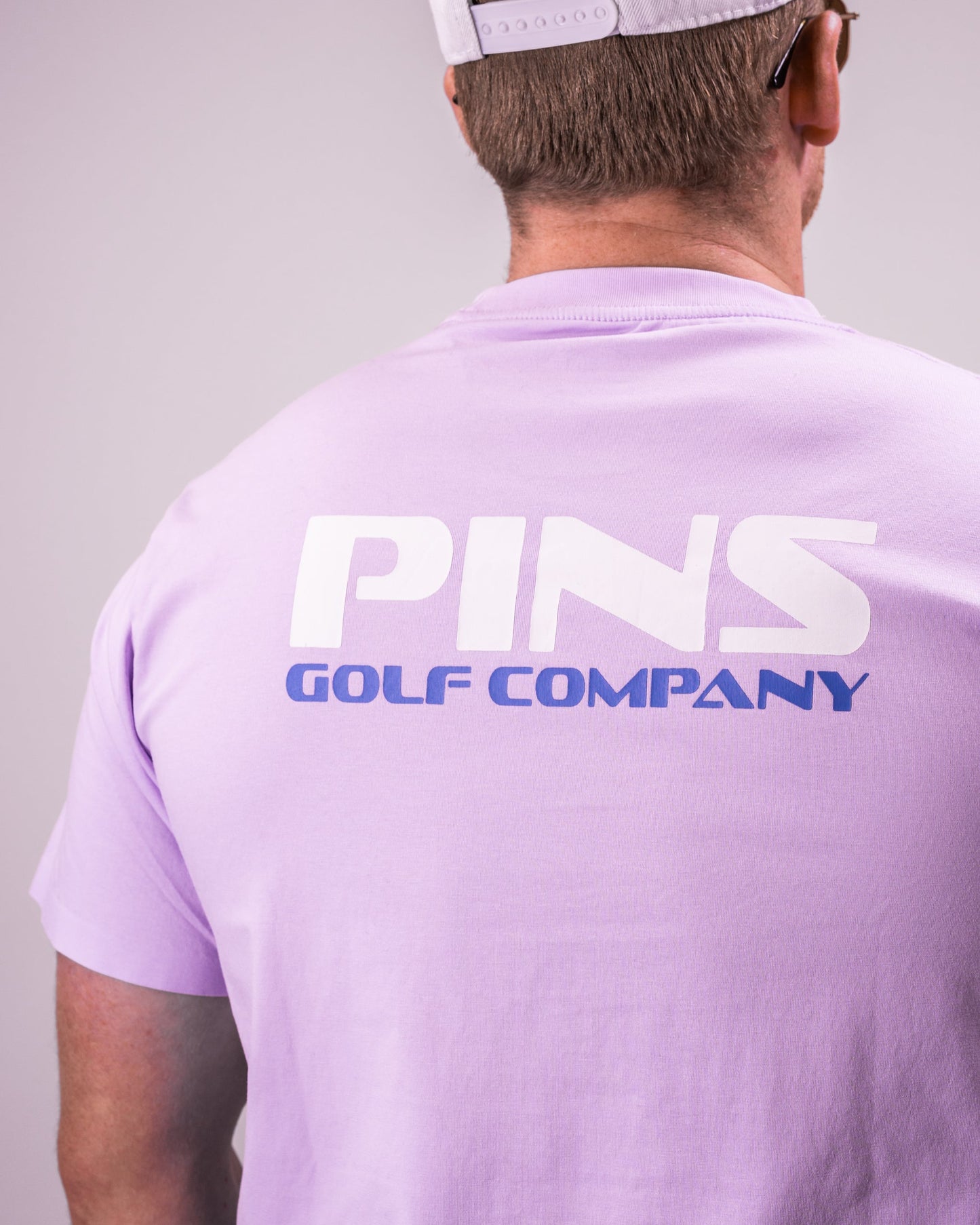 "Casual black Streamliner tee displayed on a wooden surface, showcasing its soft cotton material and relaxed fit."