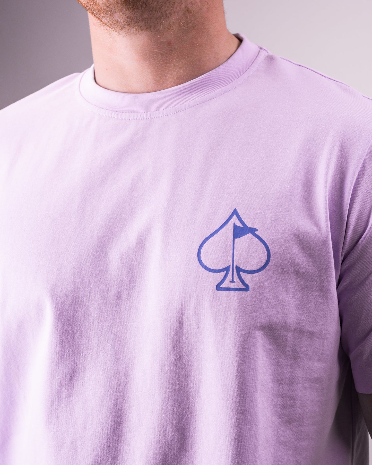 Black Streamliner tee shirt on a wooden surface, featuring a minimalist design and soft fabric texture.