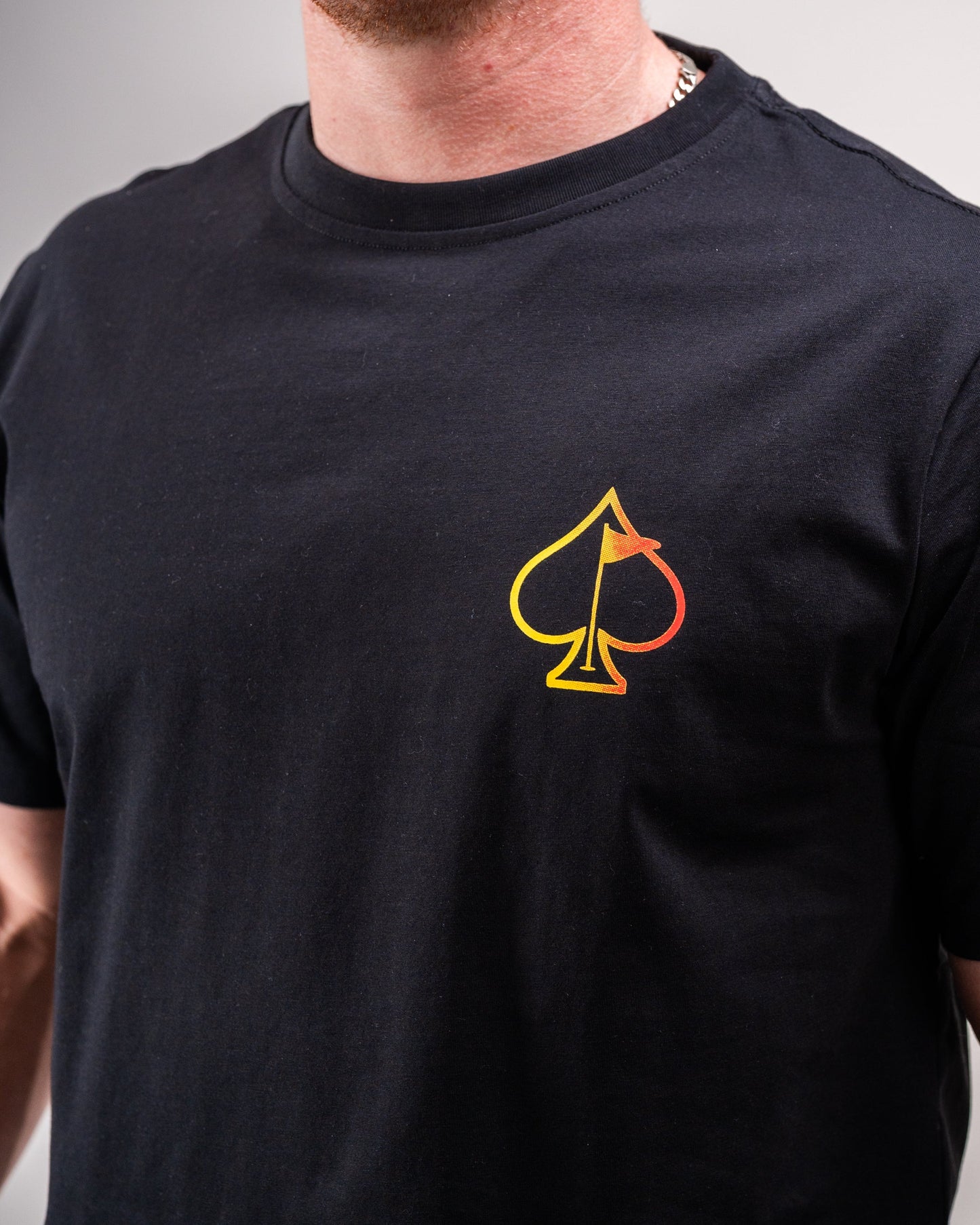 Half&Half Tee in lifestyle setting, featuring contrasting color blocks and a relaxed fit.