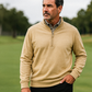 Man wearing a tan Player Preferred™ Pullover in Sand with a quarter-zip, standing outdoors on a golf course.