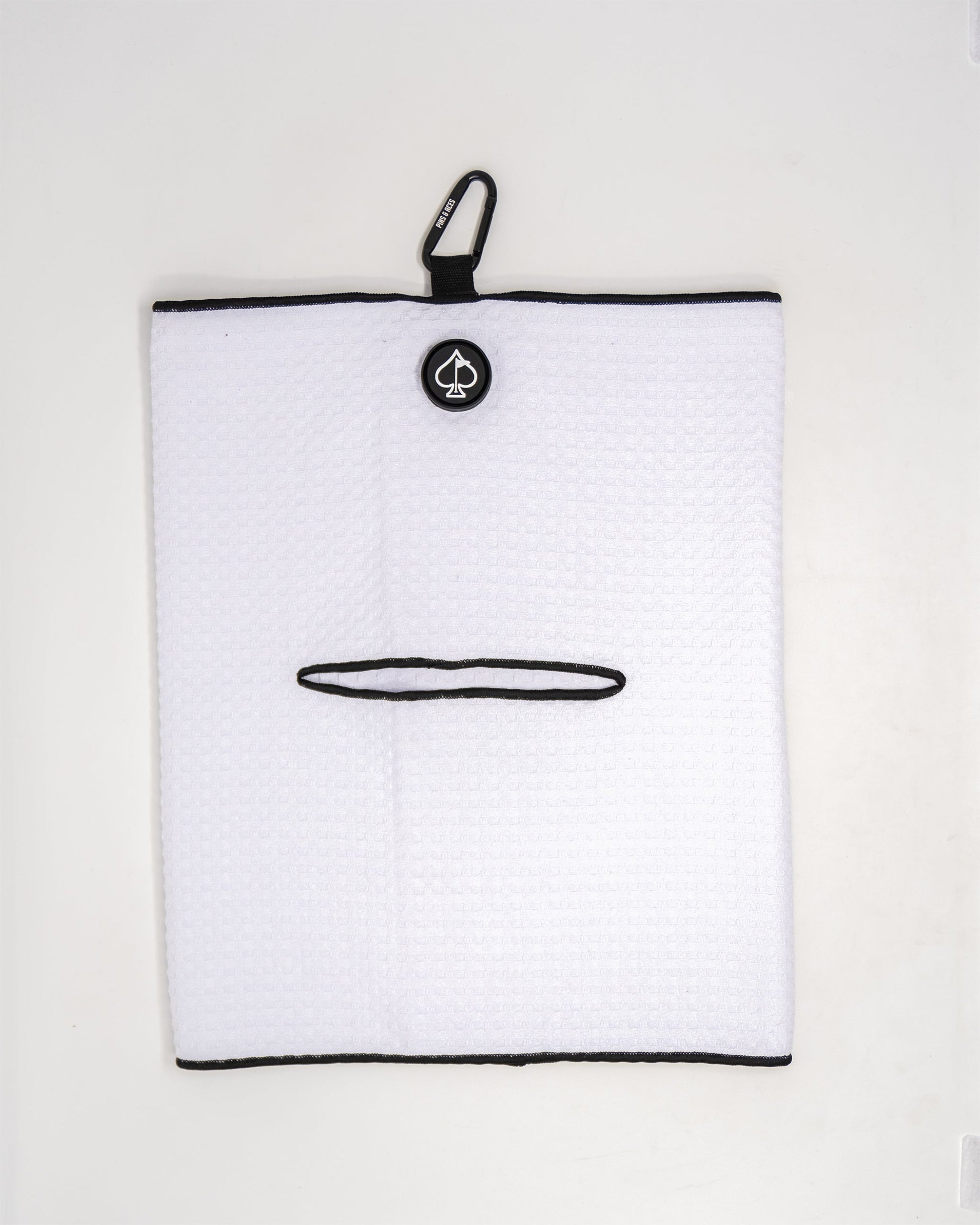 White magnetic towel with a sleek design, featuring a strong magnetic backing for easy attachment and storage.
