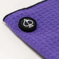 Magnetic towel in grape color displaying its vibrant design and magnetic attachment feature.