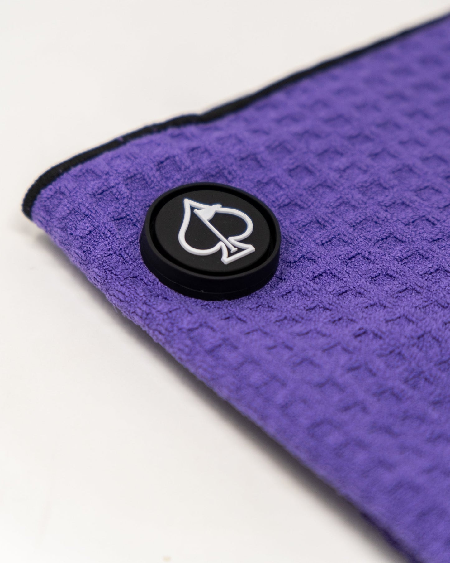 Magnetic towel in grape color displaying its vibrant design and magnetic attachment feature.