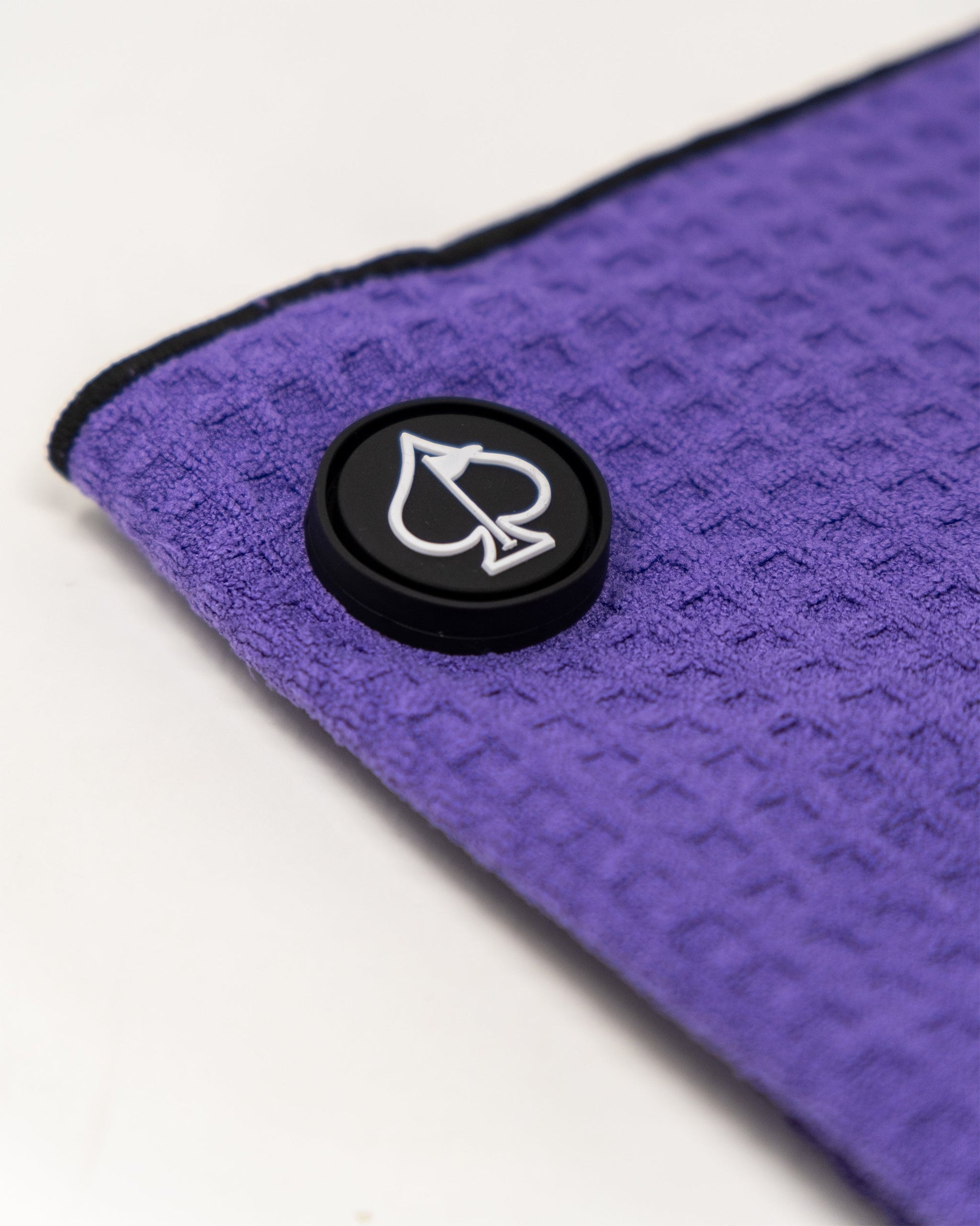 Magnetic towel in grape color displaying its vibrant design and magnetic attachment feature.