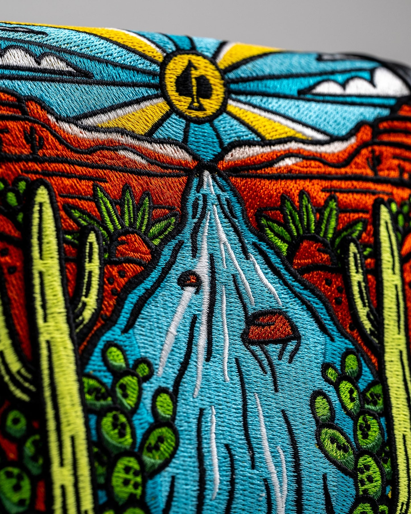 Mojave mallet putter cover in a colorful desert pattern with a stitched logo.