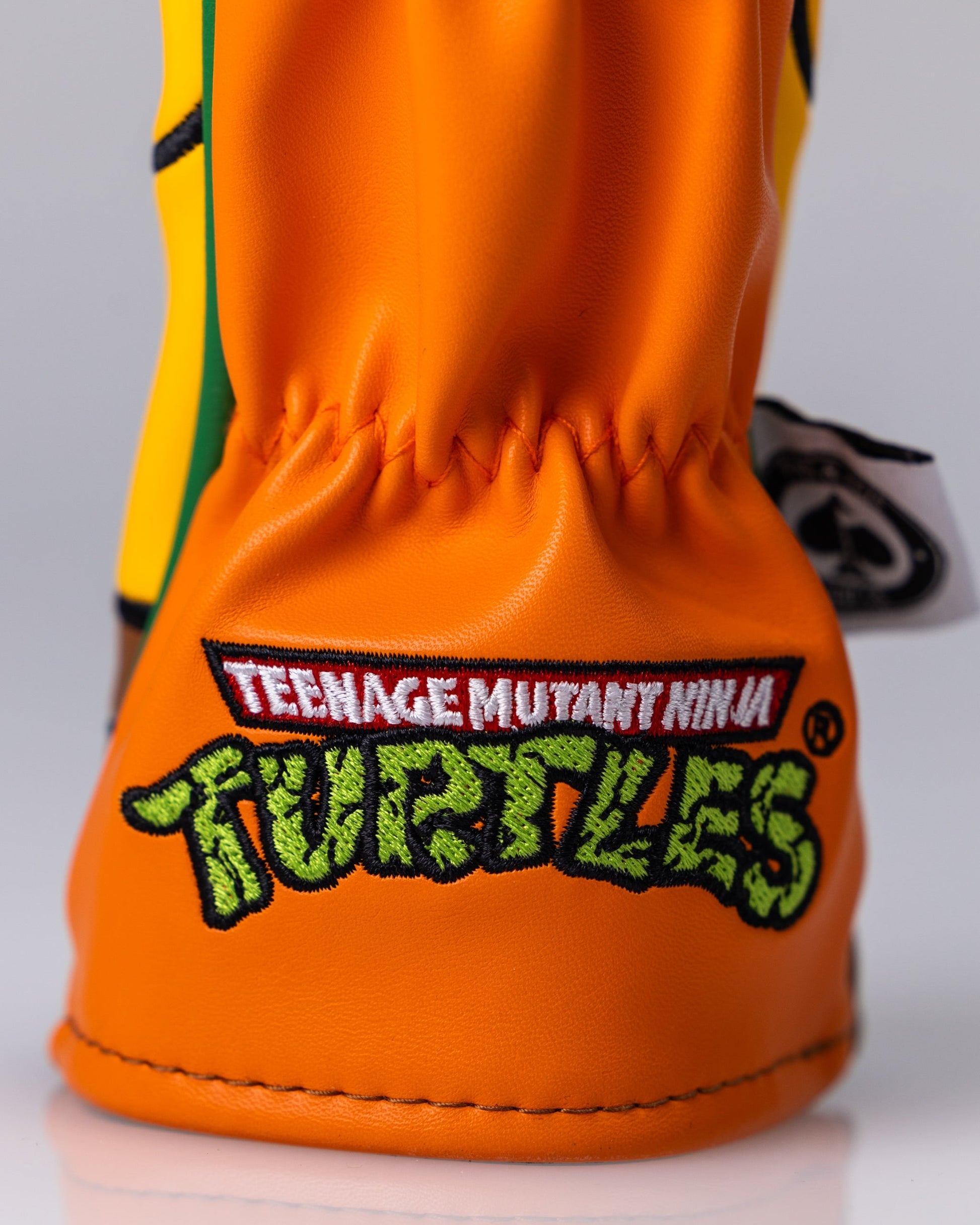 TMNT Michelangelo hybrid cover featuring vibrant artwork of the character with a dynamic pose and iconic orange bandana.