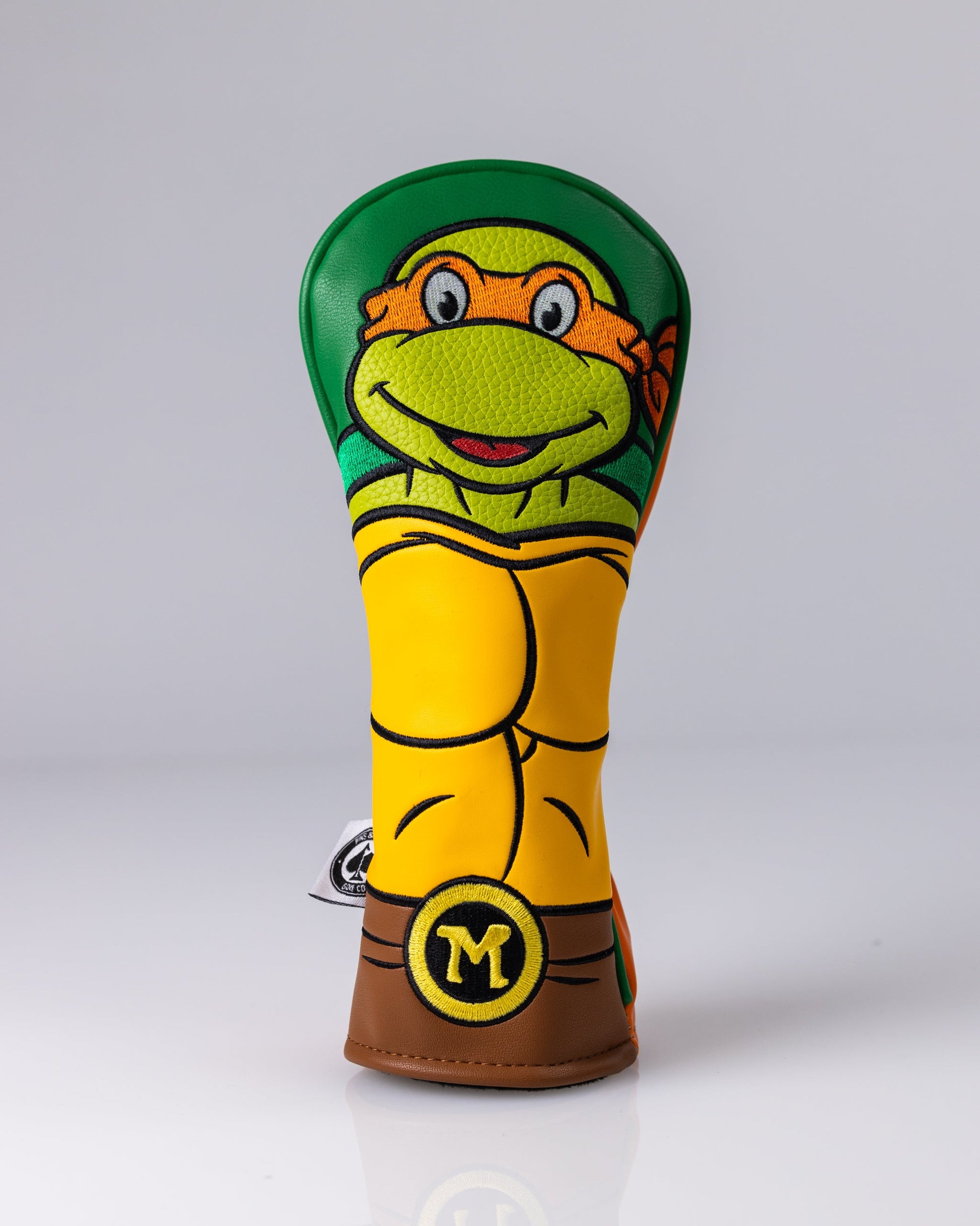 TMNT Michelangelo Hybrid Cover featuring vibrant artwork of Michelangelo in a dynamic pose with a pizza slice, showcasing his signature orange bandana and nunchaku.