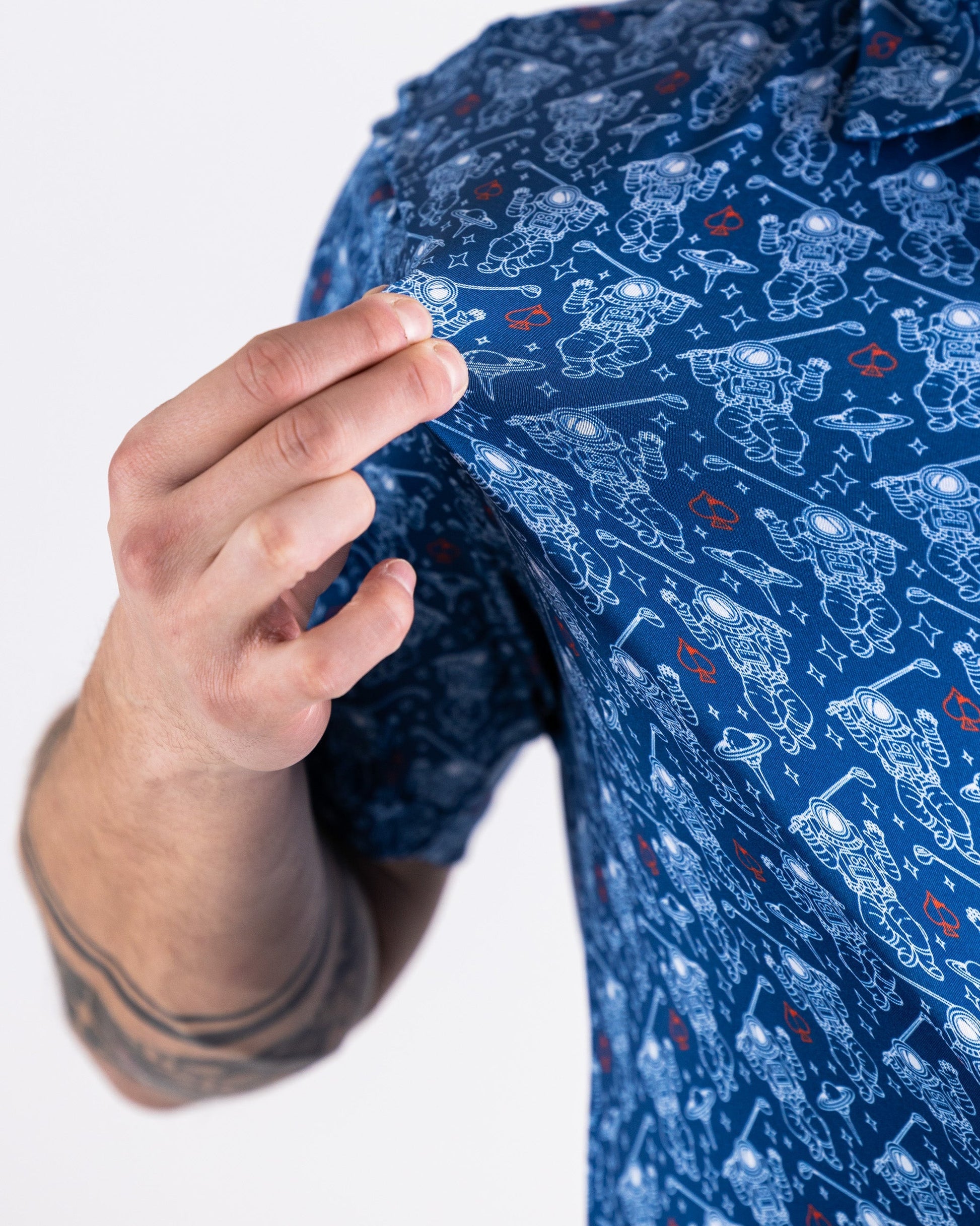 "NASA Space Walker blue polo shirt featuring the NASA logo and astronaut graphic."