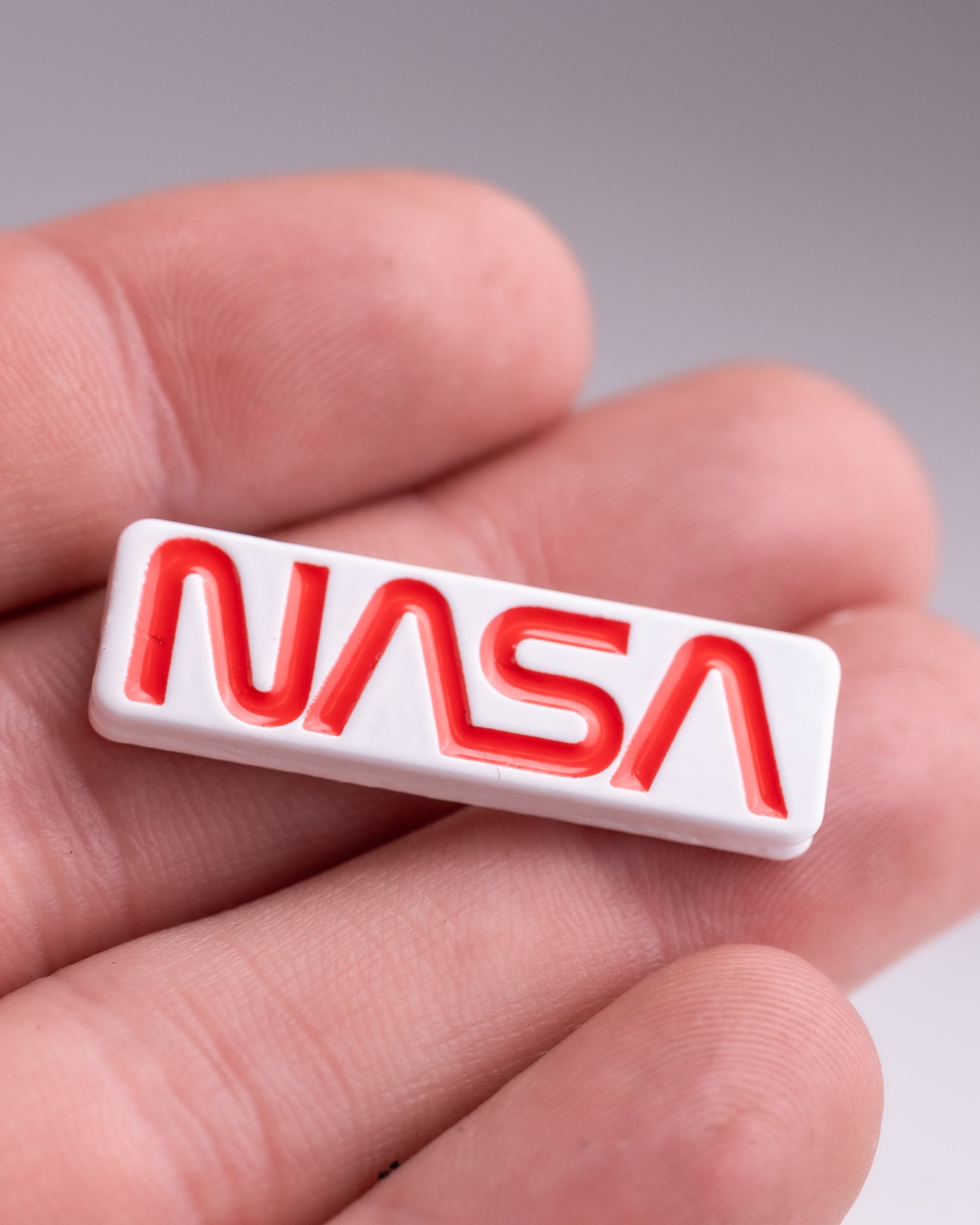 NASA "Worm" Ball Marker featuring a bold red and blue design with the iconic NASA logo.