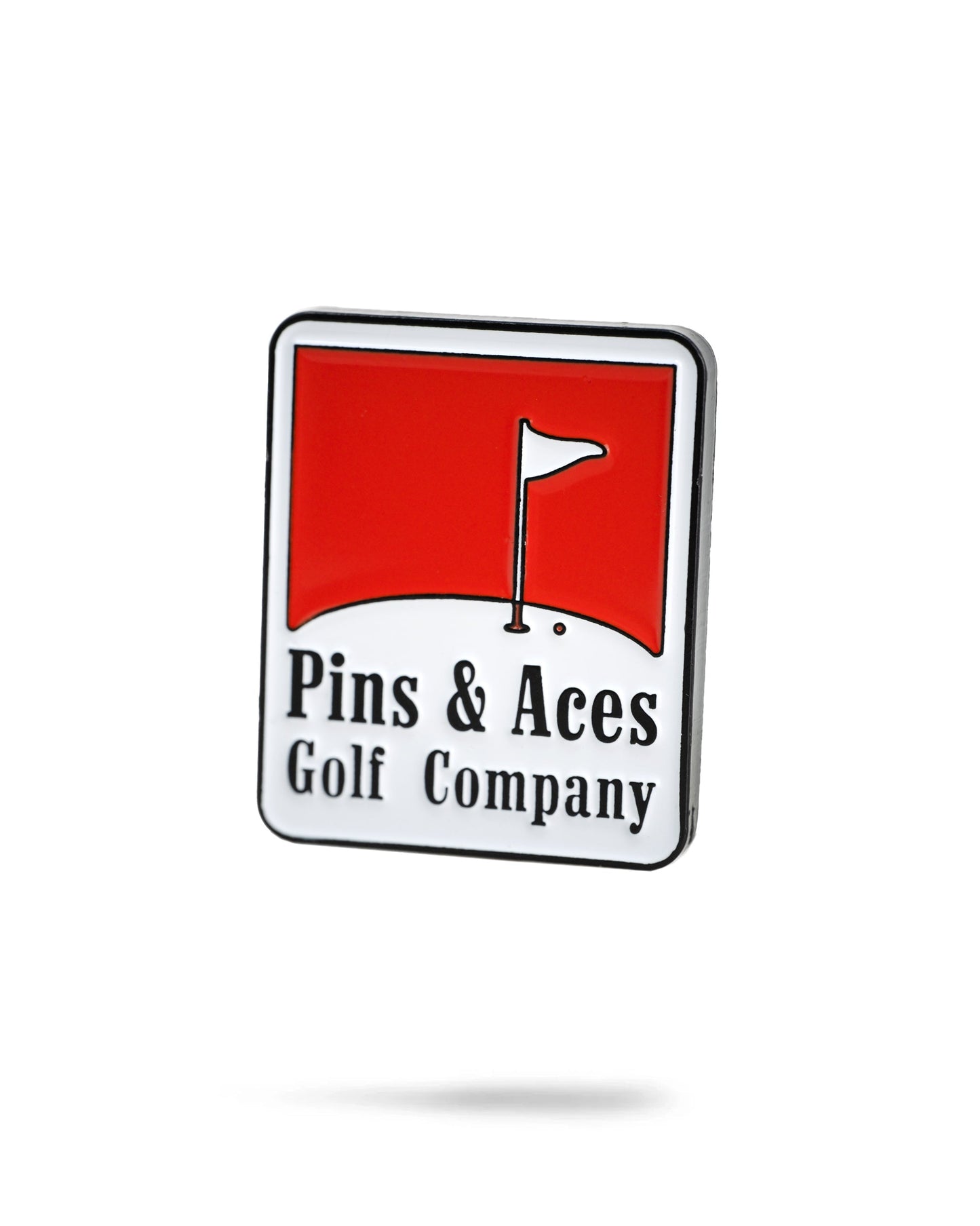 Red Pins ball marker with a sleek design, featuring the Pins logo prominently displayed in white. Ideal for golfers looking for a stylish and functional accessory.