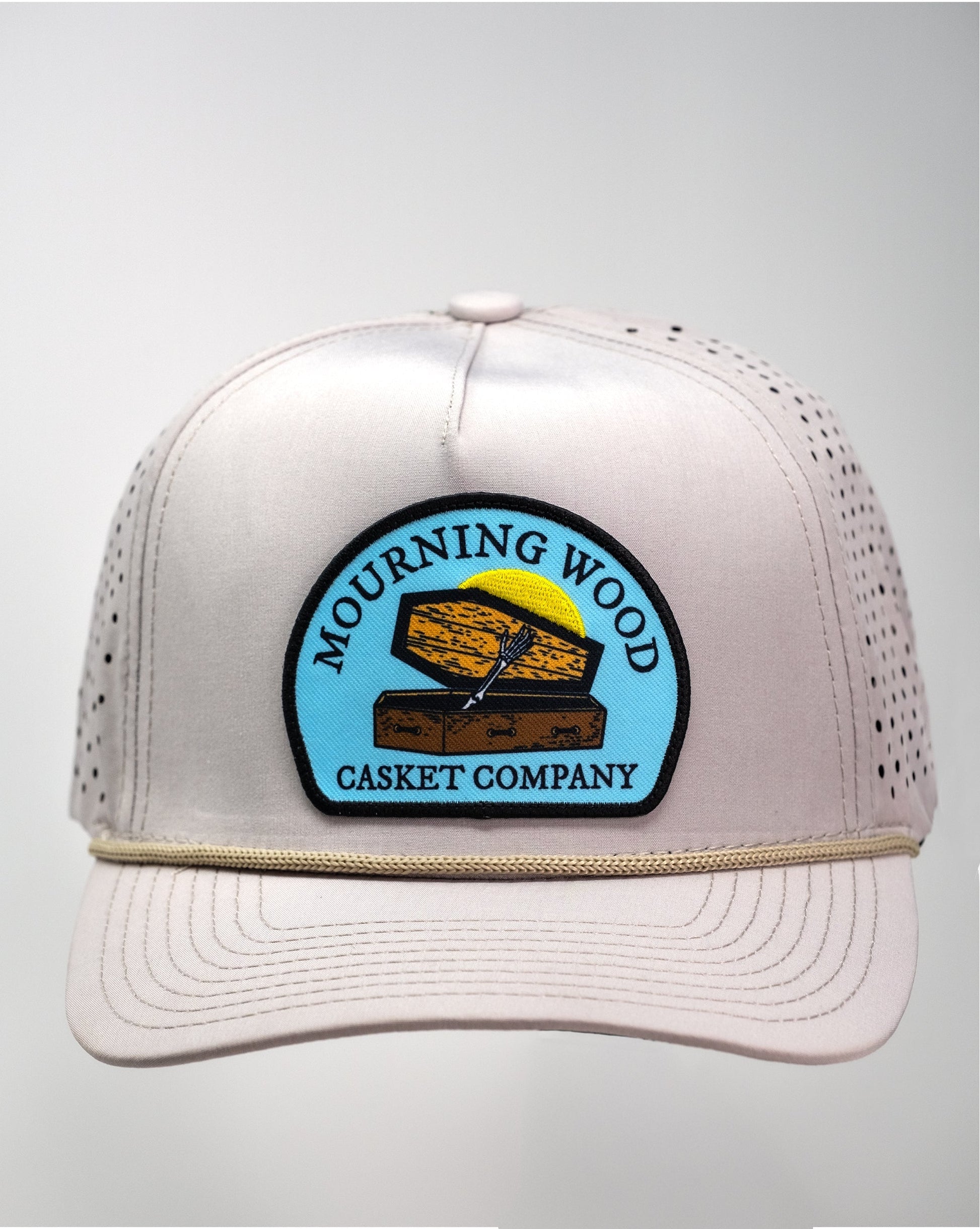 Perforated Rope Hat in Mourning Wood and Bone colors, featuring a stylish design with a rope accent.