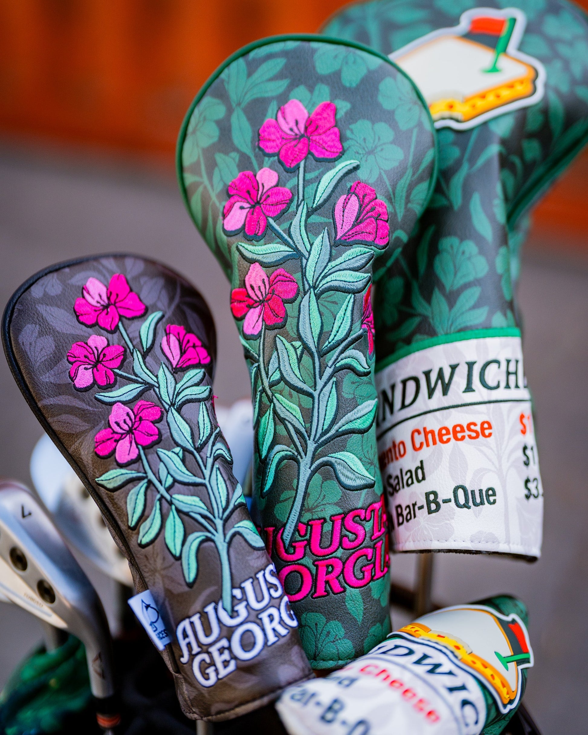 Hibiscus Bloom fairway cover featuring a vibrant floral design in shades of red and green.