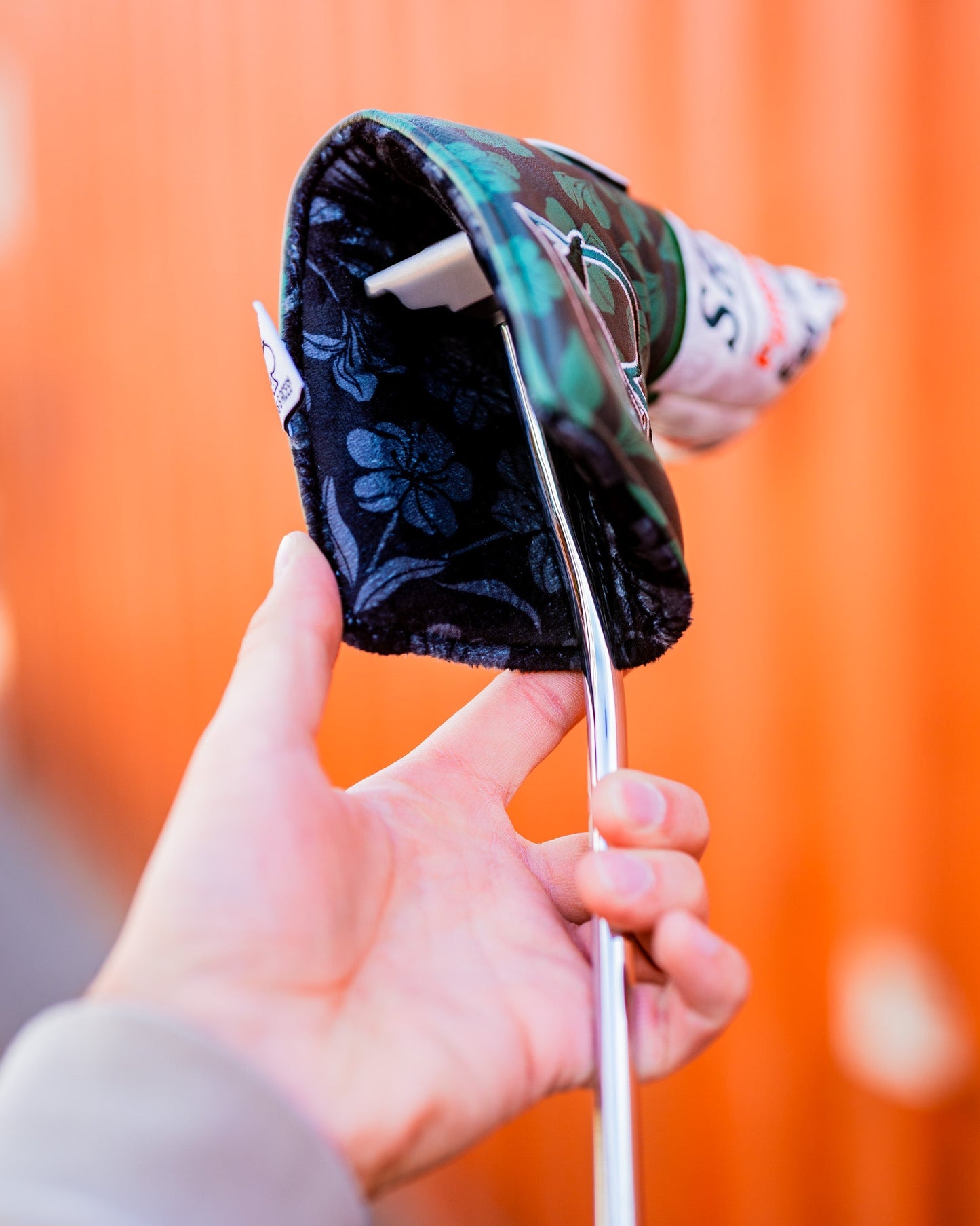 Augusta '25 Blade Putter Cover in green with a sleek design, featuring contrasting accents and an embroidered logo.