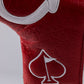 Close-up of a red golf headcover with white embroidered spade logo, textured pattern, and white trim, for bold, unique gol...