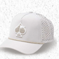 Perforated bone-colored rope hat featuring a spade logo and breathable mesh sides for stylish comfort on the golf course.