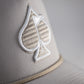 Perforated rope hat in bone color featuring a stylish embroidered spade logo and a classic rope detail.