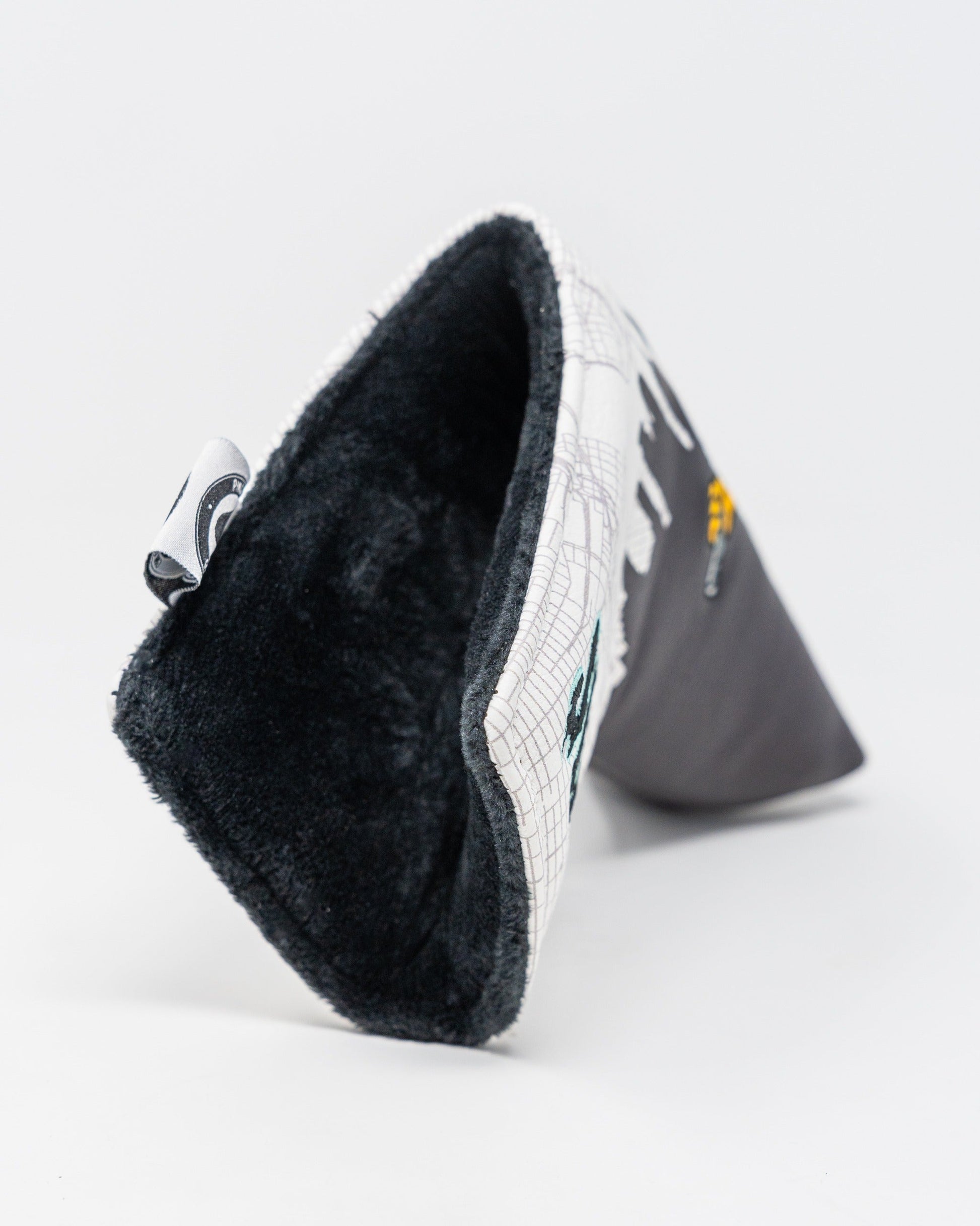 Stylish Shady Slice blade putter cover featuring a unique design and soft interior for optimal club protection.