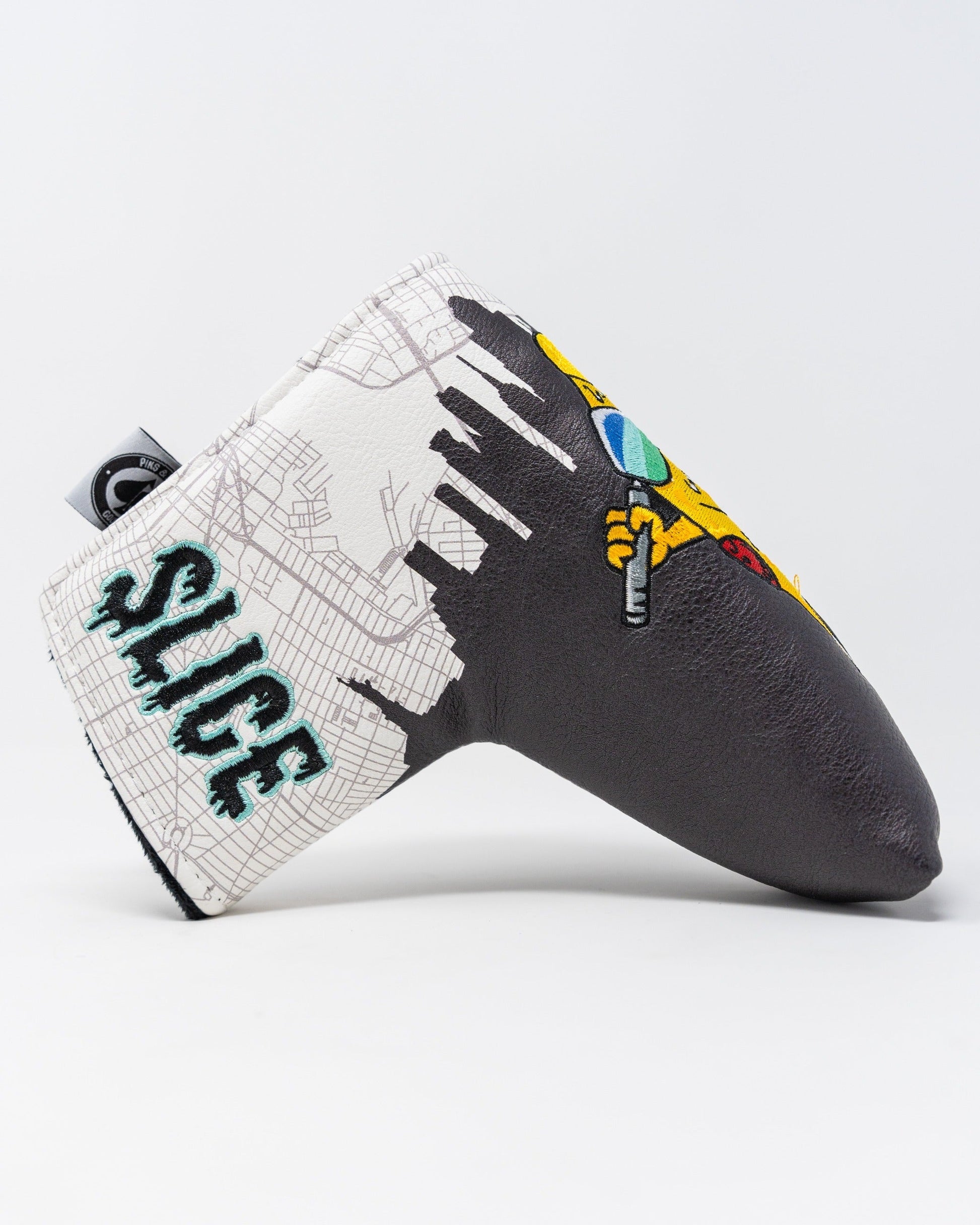 Bold Shady Slice blade putter cover featuring vibrant graphics and a unique design to enhance your golf game style.