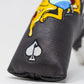 Bold black putter cover featuring colorful embroidered design and spade logo, perfect for stylish golfers.