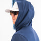Navy performance golf hoodie featuring a fitted hood, worn by a man in sunglasses and a cap, ideal for stylish golfers.