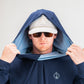 Navy performance golf hoodie with a hood, worn by a man in sunglasses and a cap, showcasing a stylish design.