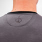 Back view of a person wearing a slate grey Player Preferred™ Crewneck with a small embroidered spade logo on the upper back.