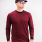 Male model wearing a maroon Player Preferred™ Crewneck in Merlot, paired with sunglasses, a black cap, and black pants.