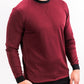 Men's maroon crewneck sweatshirt with black collar and cuffs, featuring a subtle textured pattern.