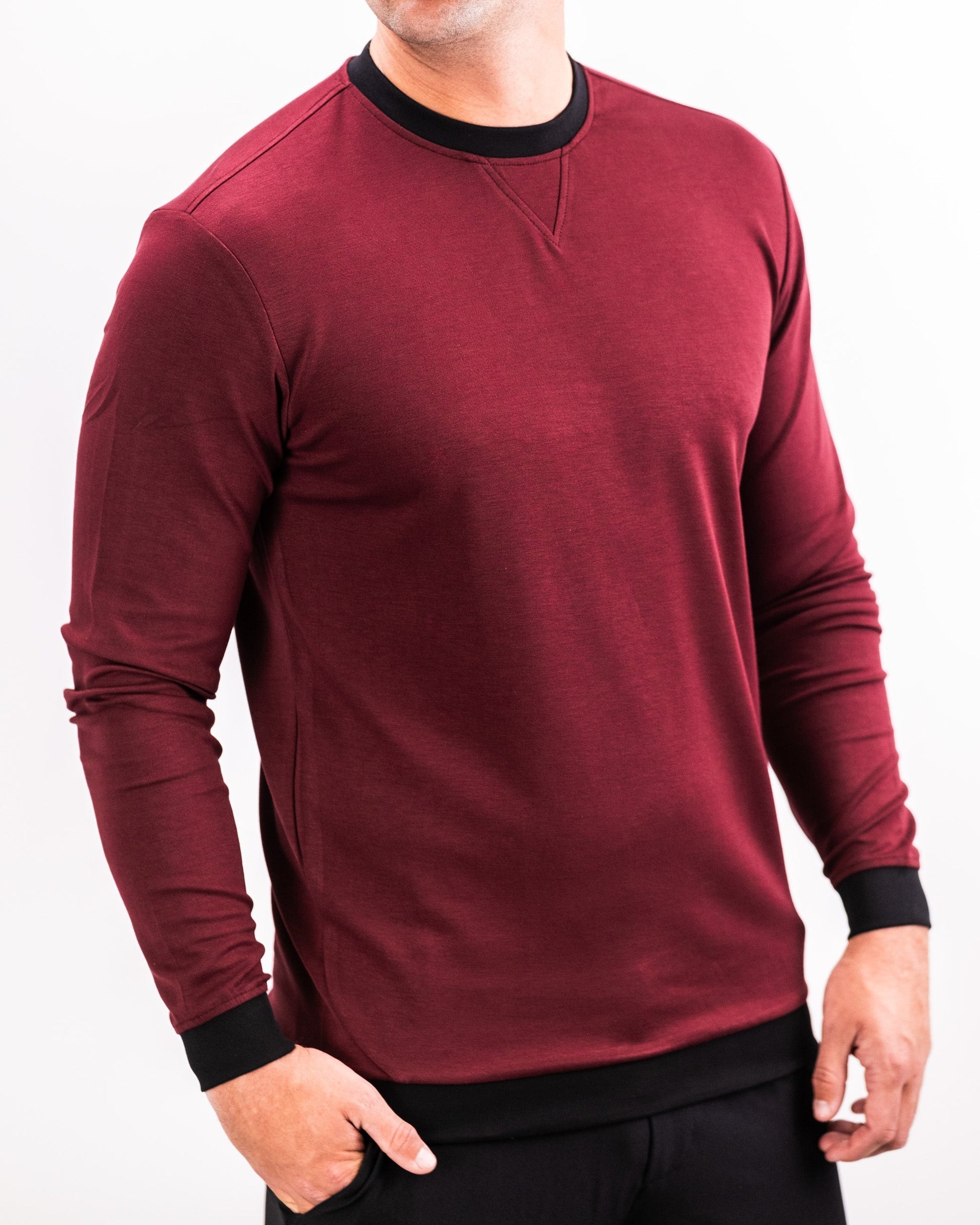 Men's maroon crewneck sweatshirt with black collar and cuffs, featuring a subtle textured pattern.